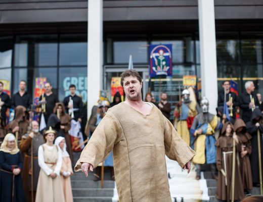 A medieval pageant actor performing
