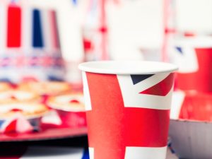 A photo with a paper Union Jack cup in the foreground