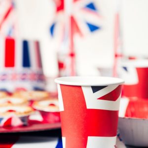 A photo with a paper Union Jack cup in the foreground